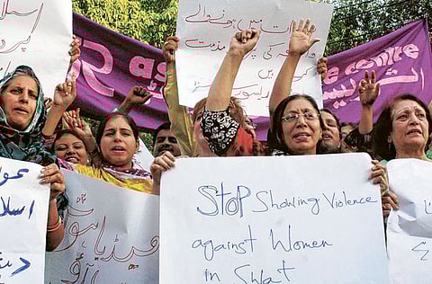 In this file picture, Pakistani women shout slogans against violence.