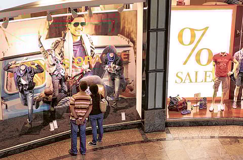 File picture of window shoppers in Oberhausen, Germany. Latest numbers indicate troubling times for the economy. 