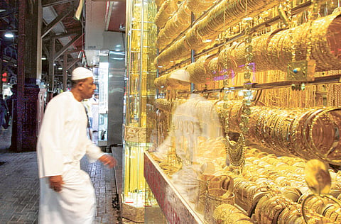 A display at a shop in Dubai’s Gold Souk. With the price of the yellow metal spiralling in theglobal market, retailers say demand for jewellery has fallen while that for bars has gone up.