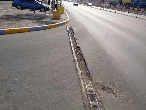 Damaged roads  and exposed metal pose danger to vehicles