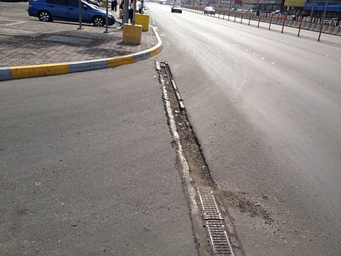 Damaged roads  and exposed metal pose danger to vehicles