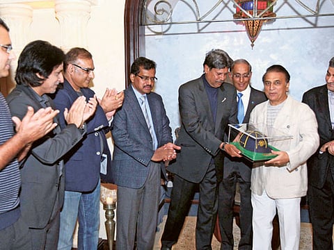 Sunil Gavaskar receiving the Hall of Fame cap by Kapil Dev in the presence of former greats in Dubai a few years back.