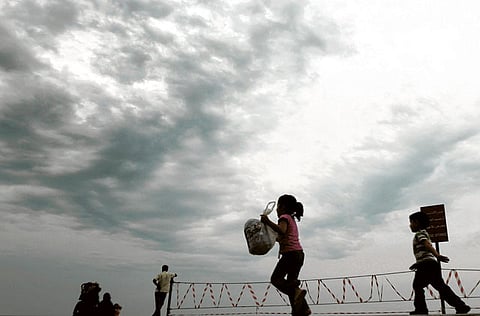 (File) Children play on Ajman beach.