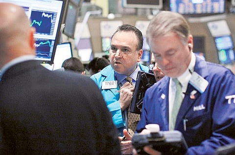 Traders at the New York Stock Exchange. Ratings giant S&P Global said on November 30, 2020 that it had agreed to an all-stock merger with IHS Markit that values the data and analysis firm at $44 billion.