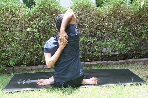 Gomukhasana: Clasp health with both hands