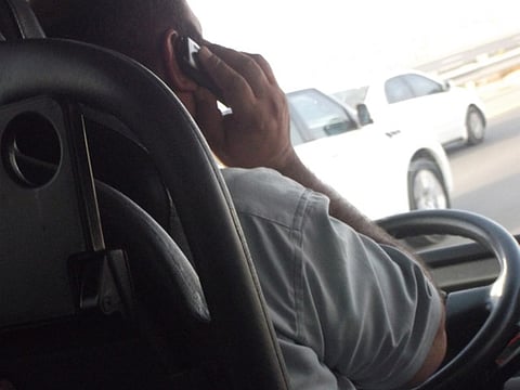 Bus driver caught on phone while driving
