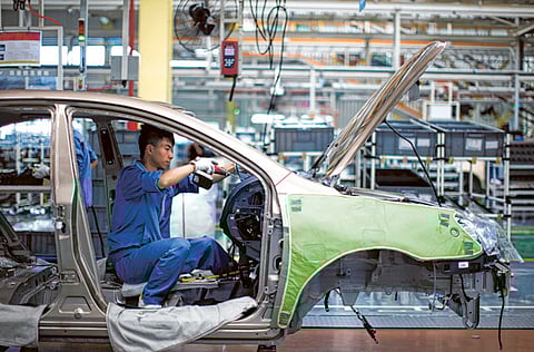 China's factory activity expanded at a slower-than-expected pace in April as supply and transport bottlenecks weighed on production.