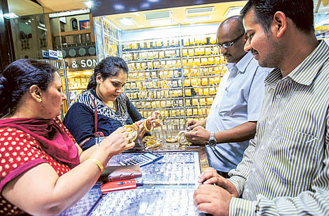 Customers at a jewellery shop in the Sharjah Central Souq. Leading gold retail chains say the
higher premium on ensuring delivery has not been passed on to showroom prices.