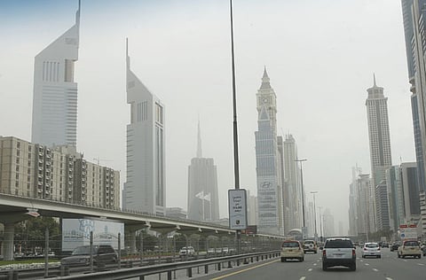 Vehicles pass through Shaikh Zayed road on a hazy Friday