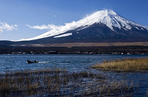 Japan's highest peak Mount Fuji, seen from Oshino village in Yamanashi prefecture. 