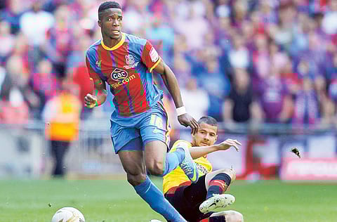 Crystal Palace striker Wilfried Zaha (left) feels being on Instagram is not fun anymore for a black footballer.