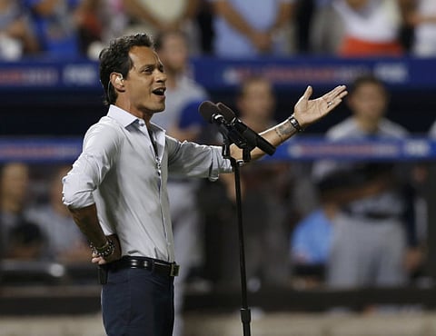 Marc Anthony sings God Bless America during the seventh inning stretch at Major League Baseball's All-Star Game in New York, July 16.