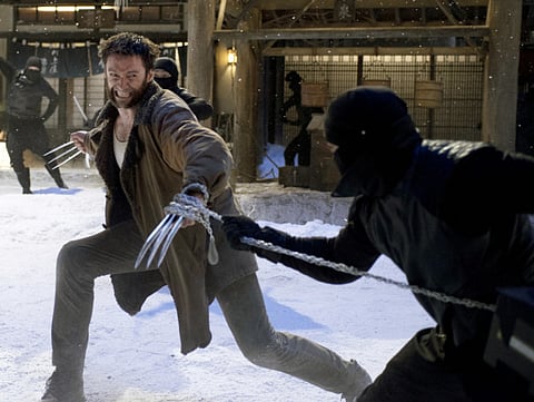 This publicity image released by 20th Century Fox shows Hugh Jackman in a scene from "The Wolverine."