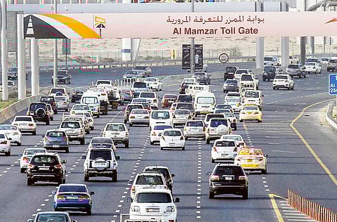 Motorists heading towards Sharjah on Al Ittihad road pass through a Salik gate.
