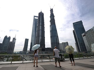 World’s second tallest building tops out in China
