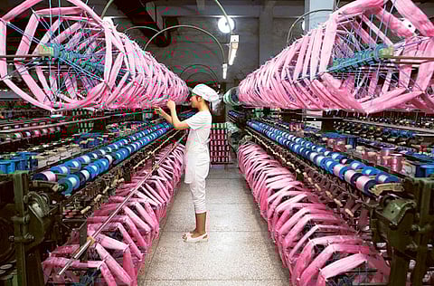 Inside a silk factory in Neijiang, Sichuan province. China's factory-gate prices remained at four-year lows in May, official data showed Wednesday, as the demand shock from the coronavirus continued to take a toll on the economy.