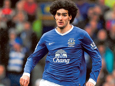 Manchester United's Marouane Fellaini will delay wrist surgery, says Belgium team doctor