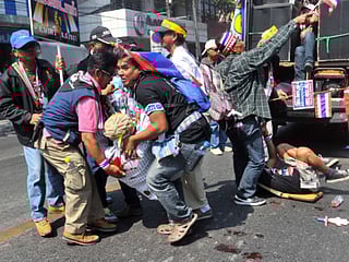 Dozens hurt by bomb blast at Thailand protest march