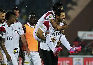  Northeast United FC’s owner Bollywood actor, John Abraham carries one of his team players.