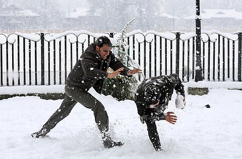 People play in the snow in Srinagar. Winter is currently at its peak with the upper reaches and plains of Kashmir receiving snowfall and rain.