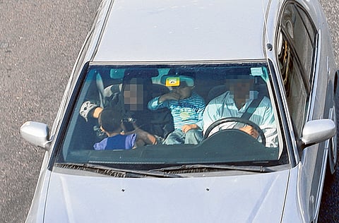 Having a child on the front seat is a traffic violation, according to the UAE Traffic Law.