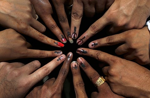 Illustrative image: Indian youth and first time voters pose as they show their fingers with ink mark after casting vote near a polling station during the sixth phase of the Indian General elections in Mumbai, India.