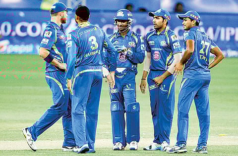 Reigning champions Mumbai Indians in action during the UAE leg of the IPL in 2014.