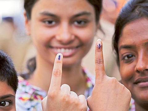 Young voters show their inked fingers after voting in Bengal,Howrah, west of Kolkata (File)