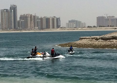 Jet skiers at Al Mamzar Beach in Sharjah.