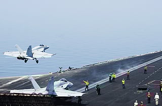 An F/A-18E Super Hornet attached to the Tomcatters of Strike Fighter Squadron (VFA) 31 takes off from the flight deck of the aircraft carrier USS George H.W. Bush 