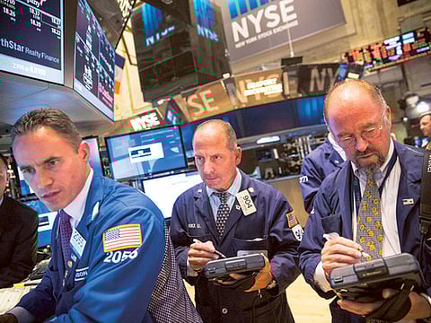 Global stocks, oil calm post massive sell-off