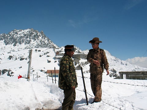 An Indian army officer (L) talks with a Chinese soldier at the 4,310 metre high Nathu-la pass (File image)