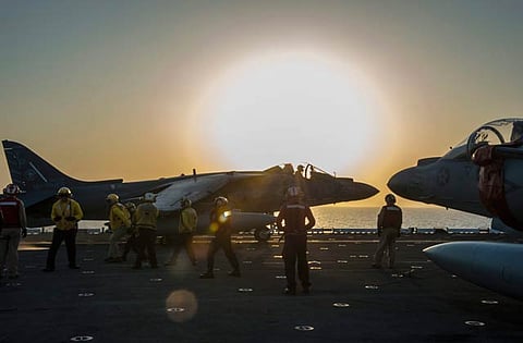 A US AV-8B Harrier jet launches from the flight deck of the amphibious assault ship USS Makin Island during flight operations in the Arabian Gulf.