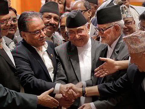 Khadga Prasad Oli (center) .