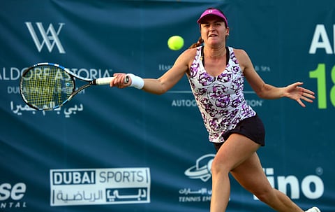 Dulgheru scrapes through into second round
