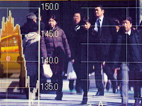 Share prices are reflected in the window of a brokerage in Tokyo [File image used for illustrative purposes only]