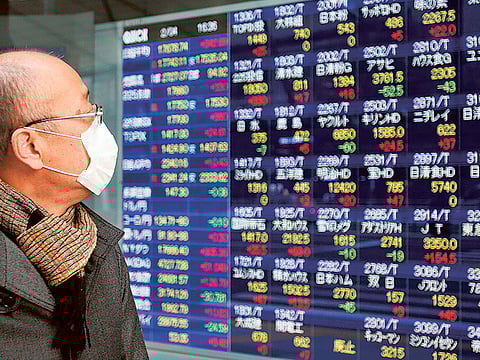 File: An electronic stock indicator in Tokyo. On April 14, 2020, Tokyo's benchmark Nikkei index jumped more than 3.1 percent to a one-month high on Tuesday as hopes for US measures to jump-start its virus-hit economy encouraged investors.