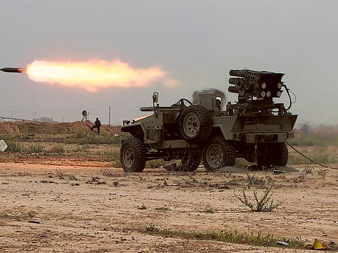 Picture for illustrative purposes only. Iraqi fighters of the government-controlled Popular Mobilisation units launch rockets towards Daesh group's fighters holed up in the centre of the city of Tikrit during a military operation to retake the city led from its western outskirt. 