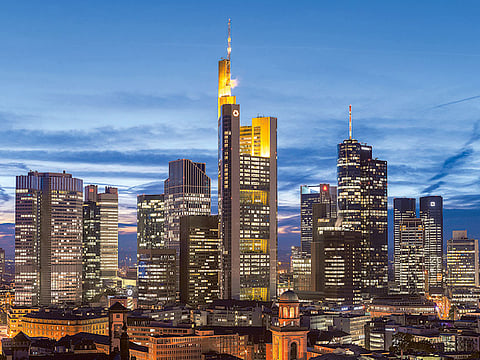 Frankfurt’s skyline at dusk. The employer-friendly German Economic Institute estimates that the labour force will shrink by more than 300,000 people this year.