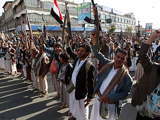 Tribal gunmen loyal to the Houthi movement brandish their weapons in the capital Sanaa. File photo taken on April 1, 2015.