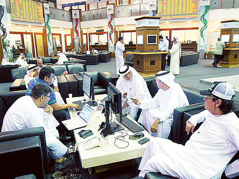 Investors at the Dubai Stock Exchange in Dubai World Trade Centre. 