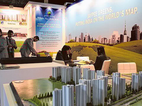 Developers and visitors at an Indian real estate event.