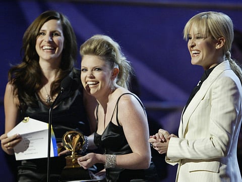 The Dixie Chicks accept their award for Best Country Performance by a Duo or Group with Vocal at the 45th annual Grammy Awards in New York February 23, 2003. The Dixie Chicks won for their record "Long Time Gone."   REUTERS/Gary Hershorn
