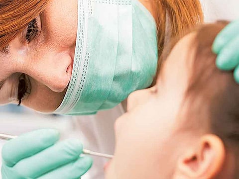 How to deal with cavities in milk teeth