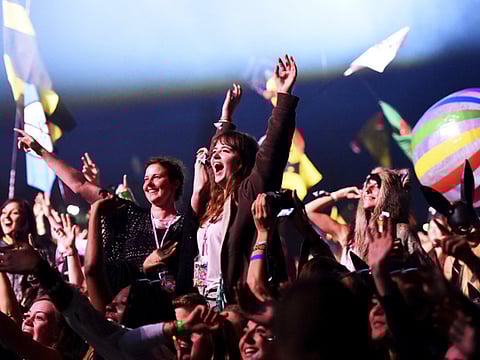 Revellers dance at the Glastonbury Festival in a file photo.