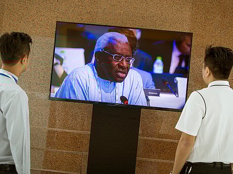 Lamine Diack speaks to IAAF volunteers in this stock photo