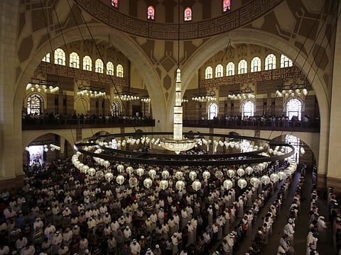Men pray at Al-Fateh Grand Mosque in Manama, Bahrain, Friday, Sept. 11, 2015. Bahrain has said that mosques will remain closed in the country till COVID-19 cases drop.