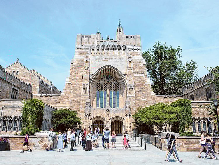 The Sterling Memorial Library at Yale University.  The cost to attend the New Haven, Connecticut school for the 2024-25 year is $91,000 and financial aid is awarded by need.