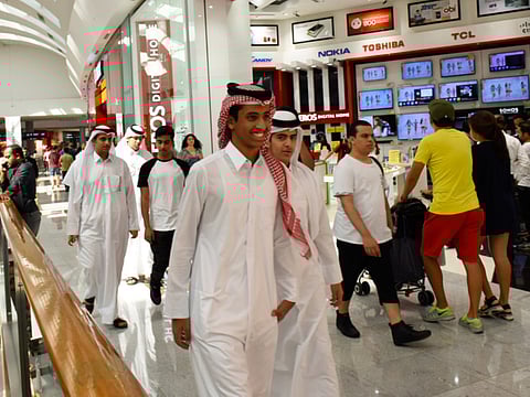 Saudi tourists take in the sight and sounds at Dubai Mall.