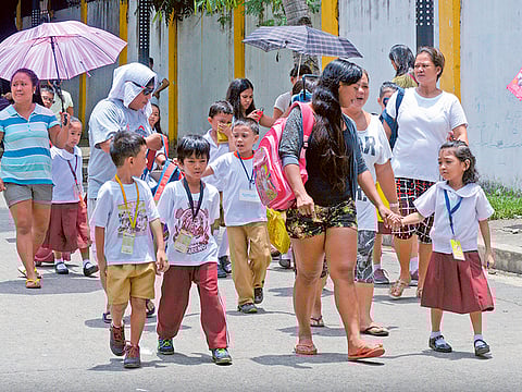 File photo: Children on their way to school for afternoon classes in the Philippines pre-COVID. The Duterte government aims to inoculate children against COVID-19 in the first quarter of 2022. 